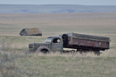 Abandoned truck in field