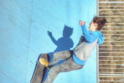 Young woman on skate ramp