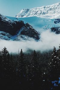 Scenic view of snow covered mountains against sky