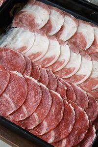 High angle view of meat on barbecue grill