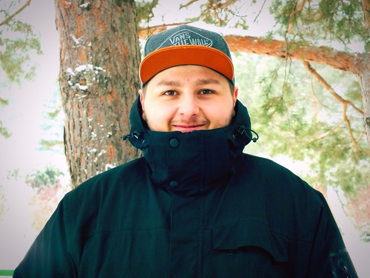 looking at camera, portrait, one person, only men, headshot, front view, adults only, young adult, winter, one young man only, human face, one man only, smiling, men, people, adult, autumn, cheerful, outdoors, day, human body part, close-up