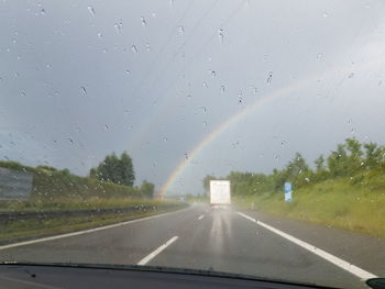 Road seen through car windshield