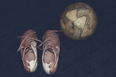 Old nike cleats and a ball, which are an unknown part of the life of a ukrainian teenager 