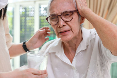 Young woman drinking glass