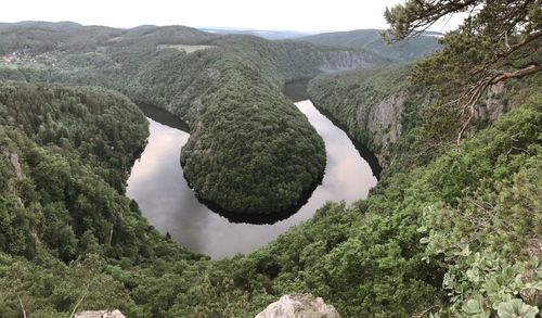 Scenic view of waterfall against sky