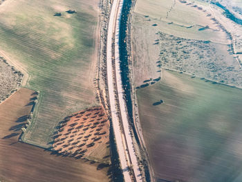 High angle view of road amidst agricultural land