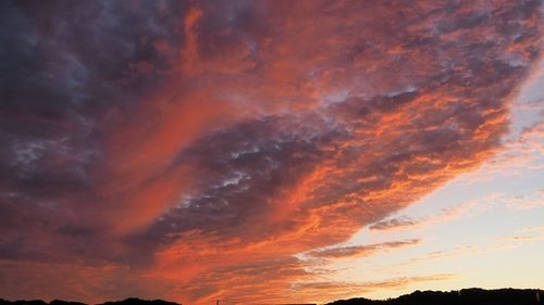 Low angle view of dramatic sky during sunset