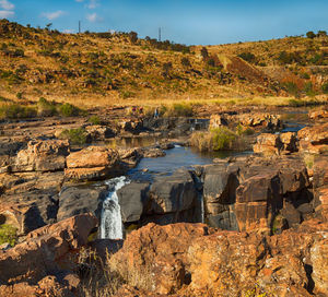 Scenic view of rock formations against sky