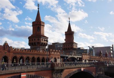 View of arch bridge and buildings against sky