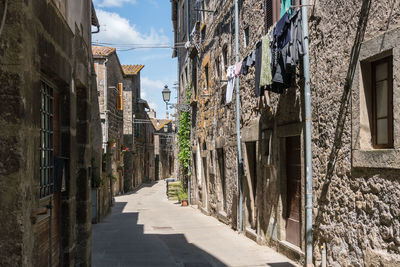 Narrow alley amidst buildings in city