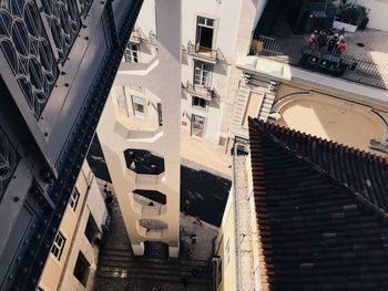 Low angle view of staircase amidst buildings in city