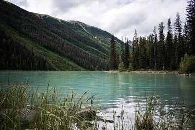 Scenic view of lake and mountains against sky