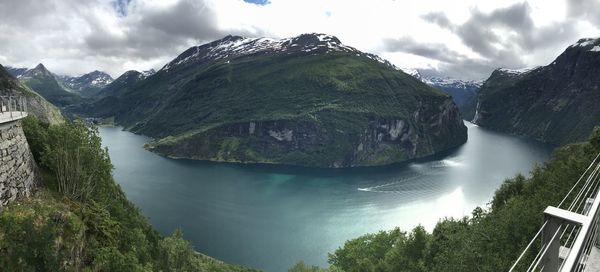 Panoramic shot of river amidst trees against sky