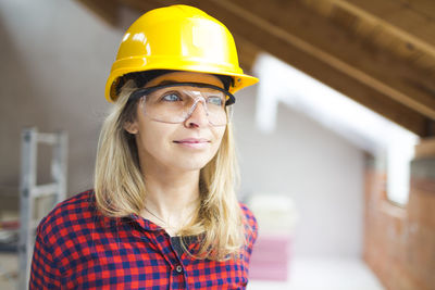 Young woman working at construction site