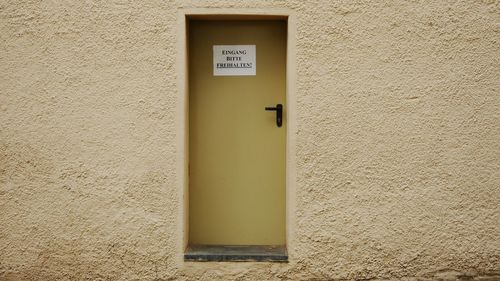 Close-up of text on wall