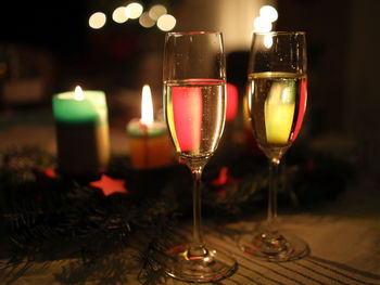 Close-up of sparkling wine glasses on table