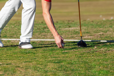 Low section of man playing with ball