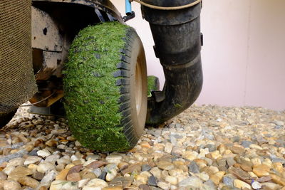 Close-up of bicycle parked on stone