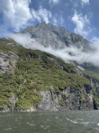 Scenic view of waterfall against sky