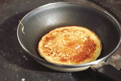 Cooking a pancake on the stove 