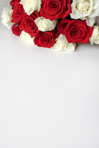 Close-up of rose bouquet against white background