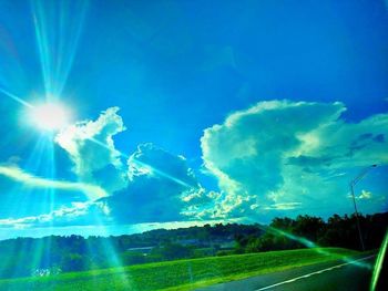 Scenic view of field against blue sky