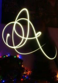 Close-up of illuminated lighting against sky at night