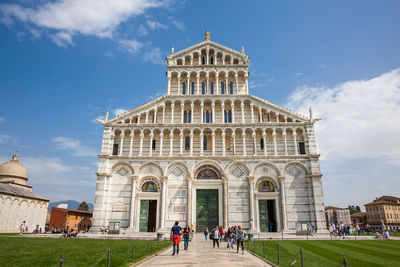 Tourists at the primatial metropolitan cathedral of the assumption of mary in pisa
