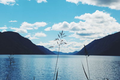 View of calm lake against mountain range