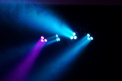 Illuminated stage lights at nightclub