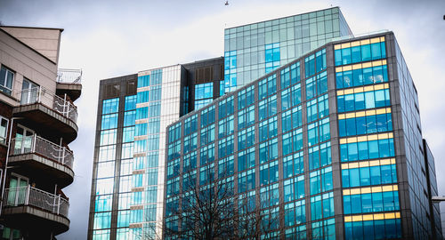 Low angle view of modern building against sky in city