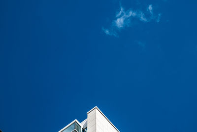 Low angle view of building against blue sky