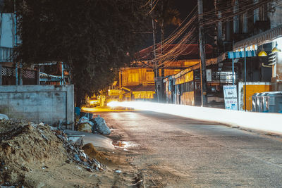 Illuminated construction site in city at night