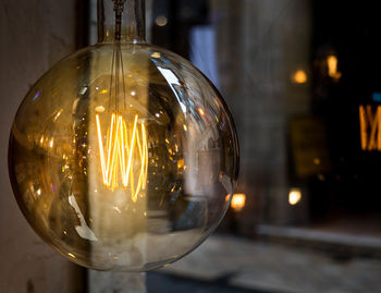 Close-up of illuminated light bulb