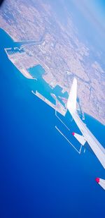 Aerial view of airplane flying in sky