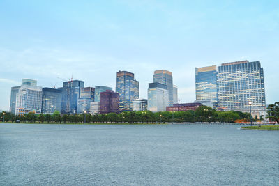 Modern buildings in city against sky