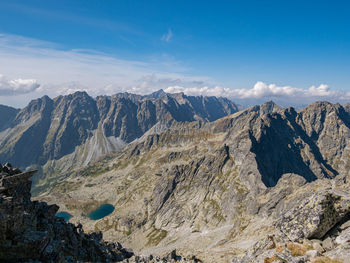 View of mountain range against cloudy sky
