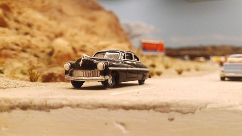 Close-up of toy car on road