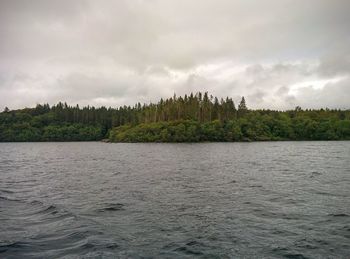 Scenic view of sea against cloudy sky