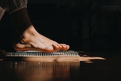 Low section of man relaxing on table