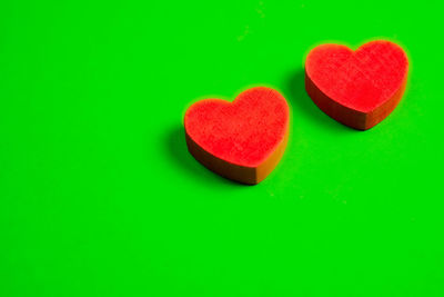 Close-up of heart shape on green background