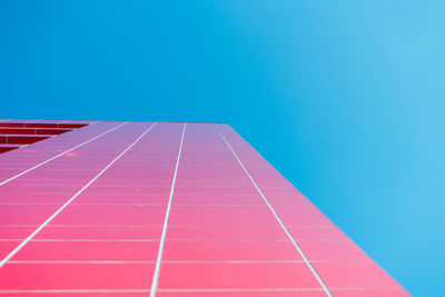 Low angle view of building against clear blue sky