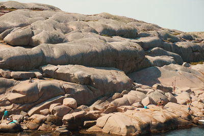 Rocks on shore against sky