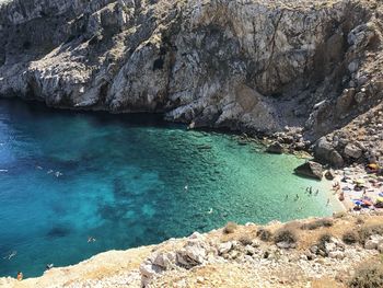 High angle view of rocks by sea