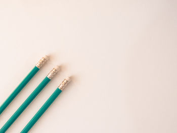 Close-up of colored pencils against white background