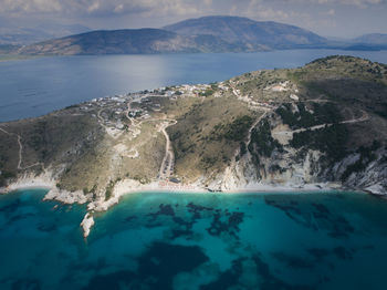 Panoramic view of sea and mountains against sky