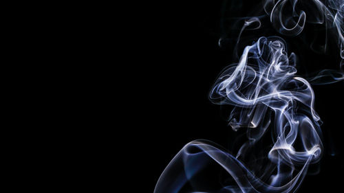 Close-up of fire against black background