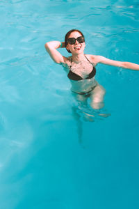 Young woman swimming in sea