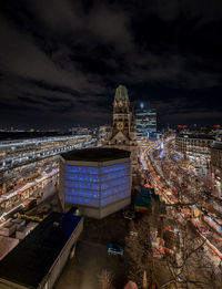 High angle view of illuminated buildings in city at night