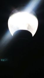 Close-up of illuminated lamp in darkroom